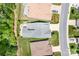 Aerial view of home highlighting roofline, backyard patio, and driveway at 4902 Looking Glass Trl, Denver, NC 28037