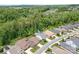 Aerial view of a suburban home nestled among green trees and manicured lawns in a quiet neighborhood at 4902 Looking Glass Trl, Denver, NC 28037