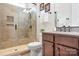 Bathroom featuring a tiled standing shower, with a glass door, and a dark wood vanity and faucet at 4902 Looking Glass Trl, Denver, NC 28037