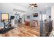 Spacious bonus room with an exercise bike, a desk area, and comfortable seating arrangement beneath a ceiling fan at 4902 Looking Glass Trl, Denver, NC 28037