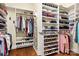 Walk-in closet with built-in shelving, hanging racks, and shoe storage, providing ample space for organization at 4902 Looking Glass Trl, Denver, NC 28037
