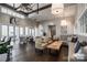 Comfortable lounge area with hardwood floors, stylish seating, and ample natural light at 4902 Looking Glass Trl, Denver, NC 28037
