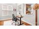 Cozy home office featuring a fireplace and a view of the backyard at 4902 Looking Glass Trl, Denver, NC 28037