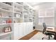 Bright office features a custom built-in bookcase and a large window at 4902 Looking Glass Trl, Denver, NC 28037