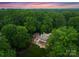 Luxury property boasting verdant surroundings, seclusion, and privacy at 5030 Hardison Rd, Charlotte, NC 28226