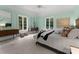 Tranquil bedroom with light walls, a large window, light-colored bedding, and natural textures at 5030 Hardison Rd, Charlotte, NC 28226