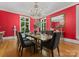 A well appointed dining room offers natural light and traditional styling and charm at 5030 Hardison Rd, Charlotte, NC 28226
