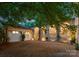 A charming outdoor space featuring a detached garage and arched terrace at 5030 Hardison Rd, Charlotte, NC 28226