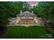 Impressive home with grand columns, manicured lawn, and meticulous landscaping at 5030 Hardison Rd, Charlotte, NC 28226