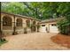 Estate featuring covered portico, multiple arches, and a two-car garage at 5030 Hardison Rd, Charlotte, NC 28226