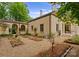 View of home exterior with a lovely garden featuring manicured beds and walkways at 5030 Hardison Rd, Charlotte, NC 28226