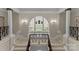 Elegant foyer with marble staircase, high ceilings, decorative lighting, and architectural details at 5030 Hardison Rd, Charlotte, NC 28226