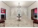 A grand foyer features a symmetrical double staircase and an intricate tiled floor design at 5030 Hardison Rd, Charlotte, NC 28226