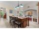 A bright kitchen features a large island, chef's oven, and tile backsplash at 5030 Hardison Rd, Charlotte, NC 28226