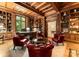 A wood-paneled office features extensive bookshelves, natural light, and a large executive desk at 5030 Hardison Rd, Charlotte, NC 28226