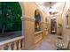 Covered patio with arched columns, stone flooring, and stylish lighting creates an inviting outdoor space at 5030 Hardison Rd, Charlotte, NC 28226
