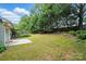 Large, level backyard with mature trees and a concrete patio at 519 Jacobs Rdg, Fort Mill, SC 29715