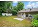 Backyard features green space, mature trees, and a small patio at 519 Jacobs Rdg, Fort Mill, SC 29715