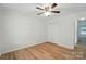 Well-lit bedroom features wood floors, a ceiling fan, and a closet at 519 Jacobs Rdg, Fort Mill, SC 29715