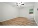 Bright bedroom featuring modern ceiling fan, ample natural light and wood-look flooring at 519 Jacobs Rdg, Fort Mill, SC 29715