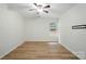 Inviting bedroom with ceiling fan, window view, and a mounted TV bracket at 519 Jacobs Rdg, Fort Mill, SC 29715