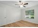 Cozy bedroom with wood floors, ceiling fan, and a view from the bright window at 519 Jacobs Rdg, Fort Mill, SC 29715