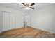 This bedroom offers natural light, wood floors, and ample closet space at 519 Jacobs Rdg, Fort Mill, SC 29715