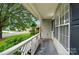 Cozy porch overlooking the street, offering a tranquil outdoor space with white railing at 519 Jacobs Rdg, Fort Mill, SC 29715