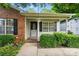Welcoming front porch with brick accents and neat landscaping, perfect for relaxing at 519 Jacobs Rdg, Fort Mill, SC 29715