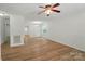 Spacious living room with wood-look flooring, ceiling fan and abundant natural light at 519 Jacobs Rdg, Fort Mill, SC 29715