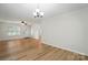 Spacious living room with wood-look floors and a glass front door at 519 Jacobs Rdg, Fort Mill, SC 29715