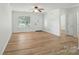 Bright living room with wood-look flooring, neutral walls, and easy access to other rooms at 519 Jacobs Rdg, Fort Mill, SC 29715