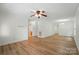 Open-concept living room featuring wood-look flooring, neutral walls, and modern lighting at 519 Jacobs Rdg, Fort Mill, SC 29715