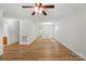 Open living space with wood-look flooring and neutral paint, seamlessly connecting to other areas at 519 Jacobs Rdg, Fort Mill, SC 29715