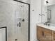 Beautiful bathroom with a glass-enclosed shower with rain shower head and herringbone tile design at 6009 Countess Dr # 50, Charlotte, NC 28217