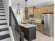 Modern kitchen with stainless steel appliances, center island, pendant lights, and white countertops at 6009 Countess Dr # 50, Charlotte, NC 28217