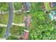 Aerial view of a home with a large backyard, mature trees, and a deck at 616 Trailing Rock Dr, Charlotte, NC 28214