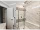 This bathroom features a glass enclosed shower with marble tile and a built-in seat at 616 Trailing Rock Dr, Charlotte, NC 28214
