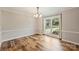 Dining room with wood floors, neutral paint and ample natural light at 616 Trailing Rock Dr, Charlotte, NC 28214