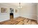 Dining room with wood floors, neutral paint and a view of the kitchen at 616 Trailing Rock Dr, Charlotte, NC 28214