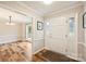 Bright and welcoming foyer with wood floors and views into the dining room at 616 Trailing Rock Dr, Charlotte, NC 28214