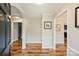 Spacious foyer with beautiful wood floors, neutral walls and decorative columns at 616 Trailing Rock Dr, Charlotte, NC 28214