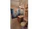Bathroom with custom shower curtain, decorative toilet, and wooden shelving at 6454 Sain Milling Rd, Vale, NC 28168
