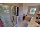 Bathroom featuring a glass shower, soaking tub, and double vanity with plenty of natural light at 6454 Sain Milling Rd, Vale, NC 28168
