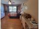 Inviting bedroom with light-colored wood flooring, large windows, and serene decor creating a relaxing space at 6454 Sain Milling Rd, Vale, NC 28168