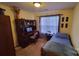Bedroom featuring a twin bed, desk, and neutral-toned walls at 6454 Sain Milling Rd, Vale, NC 28168
