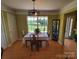 Cozy dining room with hardwood floors and a view of the backyard at 6454 Sain Milling Rd, Vale, NC 28168