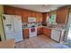 Spacious kitchen with white appliances and wooden cabinets offering ample storage at 6454 Sain Milling Rd, Vale, NC 28168