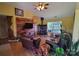 Warm living room featuring a stone fireplace and vaulted ceilings with a ceiling fan at 6454 Sain Milling Rd, Vale, NC 28168
