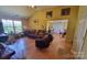 Inviting living room with hardwood floors, wood burning stove, and an open layout at 6454 Sain Milling Rd, Vale, NC 28168